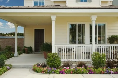 Freshly painted home with a covered front porch